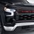 Grille in Black with Chevrolet Script Lettering in Red 85529035